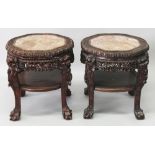 A PAIR OF FINE QUALITY 19TH CENTURY CHINESE PINK MARBLE TOP CARVED HARDWOOD STANDS, each pierced and