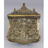 A 19TH CENTURY INDIAN BRONZE PRAYER BOX, with embossed and chased decoration and with a hinged