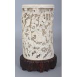 A GOOD LARGE LATE 19TH CENTURY CHINESE CARVED & PIERCED IVORY BRUSHPOT, together with a fixed wood