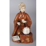 A GOOD SIGNED JAPANESE MEIJI PERIOD WOOD & IVORY OKIMONO OF A KNEELING GEISHA, engaged in a tea