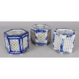 A GROUP OF THREE EARLY 20TH CENTURY JAPANESE HEXAGONAL SECTION RETICULATED PORCELAIN INCENSE POTS,