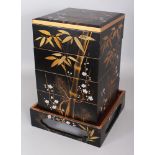 AN EARLY 20TH CENTURY JAPANESE FOUR SECTION STACKED LACQUER BOX & COVER ON STAND, of square form and