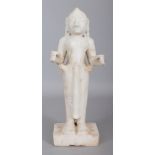A 19TH CENTURY INDIAN CARVED WHITE MARBLE FIGURE OF LAKSHMI, standing on a rectangular plinth, the