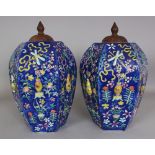 A PAIR OF 19TH CENTURY BLUE GROUND ‘100 ANTIQUES’ FAMILLE ROSE HEXAGONAL SECTION MOULDED PORCELAIN