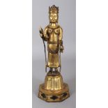 A CHINESE ARCHAIC STYLE GILT BRONZE FIGURE OF BUDDHA, standing on a raised lotus plinth above an