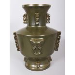 A LARGE CHINESE TEA DUST PORCELAIN VASE, of archaic bronze form, the base with an indistinct
