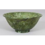 A 20TH CENTURY CHINESE JADE-LIKE HARDSTONE BOWL, the predominantly green stone with lighter and