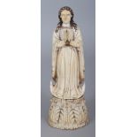 ANOTHER 19TH CENTURY GOANESE IVORY CARVING OF THE VIRGIN MARY, standing in an attitude of prayer