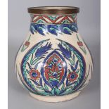 AN ISNIK STYLE GLAZED POTTERY VASE, the neck fitted with a metal band, 7.7in wide at widest