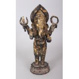 AN 18TH/19TH CENTURY THAI GILDED & LACQUERED BRONZE FIGURE OF GANESH, standing on a double lotus