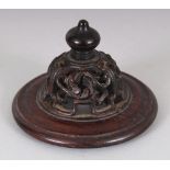 A SMALL 19TH CENTURY CHINESE HARDWOOD VASE COVER, pierced with scroll and fretwork, 3in diameter &