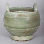 A CHINESE MING STYLE LONGQUAN CELADON STONEWARE CANDLE HOLDER, with double upright lug handles, 4.