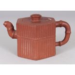 ANOTHER 19TH CENTURY CHINESE YIXING POTTERY TEAPOT & COVER, of hexagonal section ribbed form, the