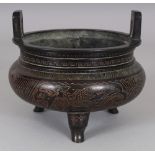 A CHINESE BRONZE TRIPOD CENSER, weighing 1.16Kg, the sides with phoenix panels reserved on a