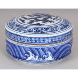 A CHINESE MING STYLE BLUE & WHITE CIRCULAR PORCELAIN DRAGON BOX & COVER, the base with a six-