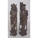 A PAIR OF 20TH CENTURY CHINESE WIRE INLAID CARVED WOOD FIGURES OF IMMORTALS, each standing on a