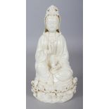 A CHINESE BLANC-DE-CHINE PORCELAIN FIGURE OF GUANYIN, seated on a lotus and wave plinth, the reverse