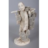 A LARGE FINE QUALITY SIGNED JAPANESE MEIJI PERIOD IVORY CARVING OF A BASKET SELLER, standing with