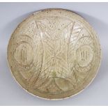 A SONG STYLE CELADON STUDIO CERAMIC BOWL, the interior with underglaze incised decoration, the