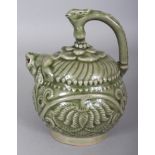 A CHINESE SONG STYLE MOULDED CELADON EWER, with a flower head pierced base, possibly intended for