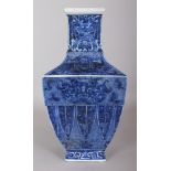 A CHINESE BLUE & WHITE ARCHAIC STYLE SQUARE SECTION PORCELAIN VASE, the base with a Qianlong seal