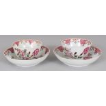 A PAIR OF 18TH CENTURY CHINESE FAMILLE ROSE PORCELAIN TEABOWLS & SAUCERS, painted in predominantly
