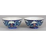 A SMALL PAIR OF CHINESE TONGZHI MARK & PERIOD BLUE GROUND PORCELAIN BOWLS, each painted with
