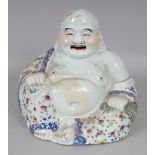 AN EARLY 20TH CENTURY CHINESE REPUBLIC PERIOD FAMILLE ROSE PORCELAIN FIGURE OF BUDAI, the unglazed