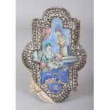 A SMALL 19TH CENTURY PERSIAN QAJAR GLAZED SHAPED CERAMIC TILE, painted with a potentate and his