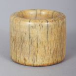 AN EARLY 20TH CENTURY CHINESE IVORY ARCHER’S RING, 1.1in diameter & 0.9in high.