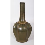 A CHINESE TEA DUST PORCELAIN BOTTLE VASE, with ribbed and lobed sides, the base with an indistinct