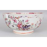 AN 18TH CENTURY CHINESE FAMILLE ROSE PORCELAIN BOWL, painted with floral sprays and conch shells,