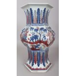 A CHINESE COPPER-RED & UNDERGLAZE-BLUE HEXAGONAL SECTION PORCELAIN VASE, 14.5in high.