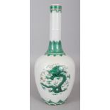 A CHINESE GREEN ENAMELLED PORCELAIN DRAGON BOTTLE VASE, the base with a Qianlong seal mark, 12.
