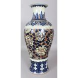 A LARGE 19TH CENTURY CHINESE COPPER-RED & UNDERGLAZE-BLUE BALUSTER PORCELAIN VASE, 18in high.