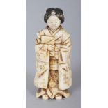 A SMALL JAPANESE MEIJI PERIOD STAINED IVORY OKIMONO OF A STANDING LADY, her hair stained black, 2.