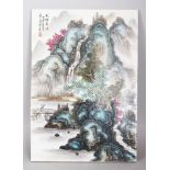 A CHINESE FAMILLE ROSE RECTANGULAR PORCELAIN PLAQUE, decorated with a mountainous river landscape,