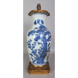 A 19TH CENTURY CHINESE ORMOLU MOUNTED BLUE & WHITE PORCELAIN VASE, fitted for electricity, 21.1in