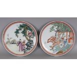A PAIR OF CHINESE 20TH CENTURY STYLE FAMILLE ROSE PORCELAIN PLATES, each decorated with a