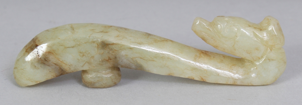 A CHINESE CELADON JADE BELT HOOK, 3.25in long.