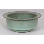 A CHINESE JUN WARE CERAMIC BOWL, with a flanged rim, 6.7in diameter & 2.6in high.