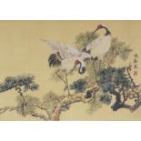A 20TH CENTURY FRAMED CHINESE PAINTING ON SILK, depicting a pair of storks perched on pine, the