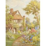 Howard Neville Walford (1864-1950) British. A Garden Scene with a Lady by a Cottage, Watercolour,