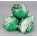 AN UNUSUAL CHINESE FAMILLE VERTE CERAMIC GROUP OF THREE PEACHES, possibly Kangxi period, applied