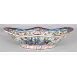 AN 18TH CENTURY CHINESE CLOBBERED SHAPED OVAL PORCELAIN BOWL, painted in underglaze-blue and
