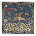 AN EARLY 20TH CENTURY CHINESE WOVEN FABRIC RANK BADGE, 11.75in wide x 11.4in high.