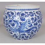 A GOOD QUALITY CHINESE BLUE & WHITE PORCELAIN JARDINIERE, decorated with repeated phoenix reserved