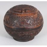 A GOOD QUALITY 19TH CENTURY CHINESE CARVED WOOD SPHERICAL BOX & COVER, the domed cover carved with a