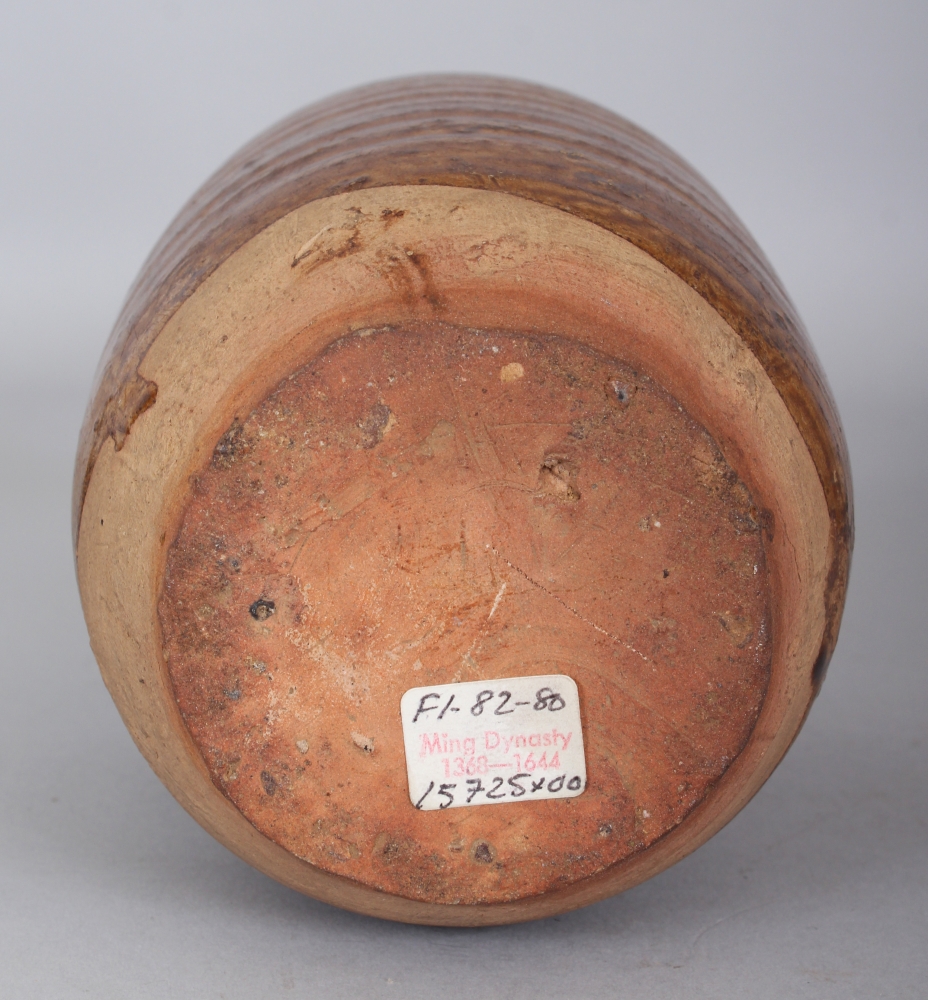 A SOUTH-EAST ASIAN MING DYNASTY BROWN GLAZED POTTERY JAR, possibly Sawankhalok, with four moulded - Image 4 of 5