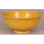 A GOOD QUALITY CHINESE YELLOW GLAZED PORCELAIN BOWL, the base with a six-character Kangxi mark and